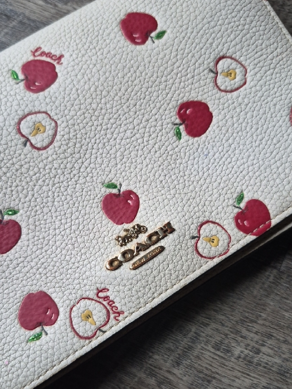 Coach Anna Foldover Clutch Crossbody Bag in a white color with a red apple print - Picture 5 of 16